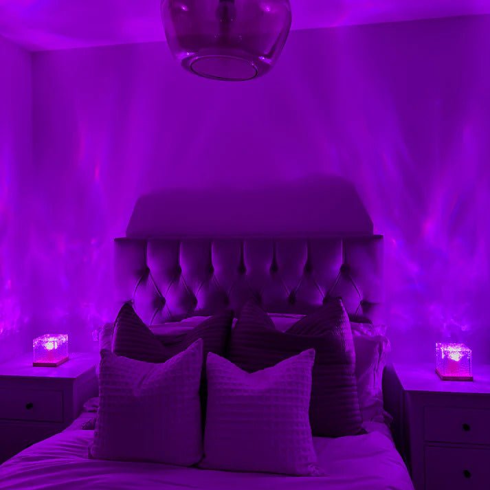 Bedroom bathed in soothing purple light from Wave Projector Water Ripple Lamp – Ideal for Relaxation, Ambient Lighting, and Unique Home Decor